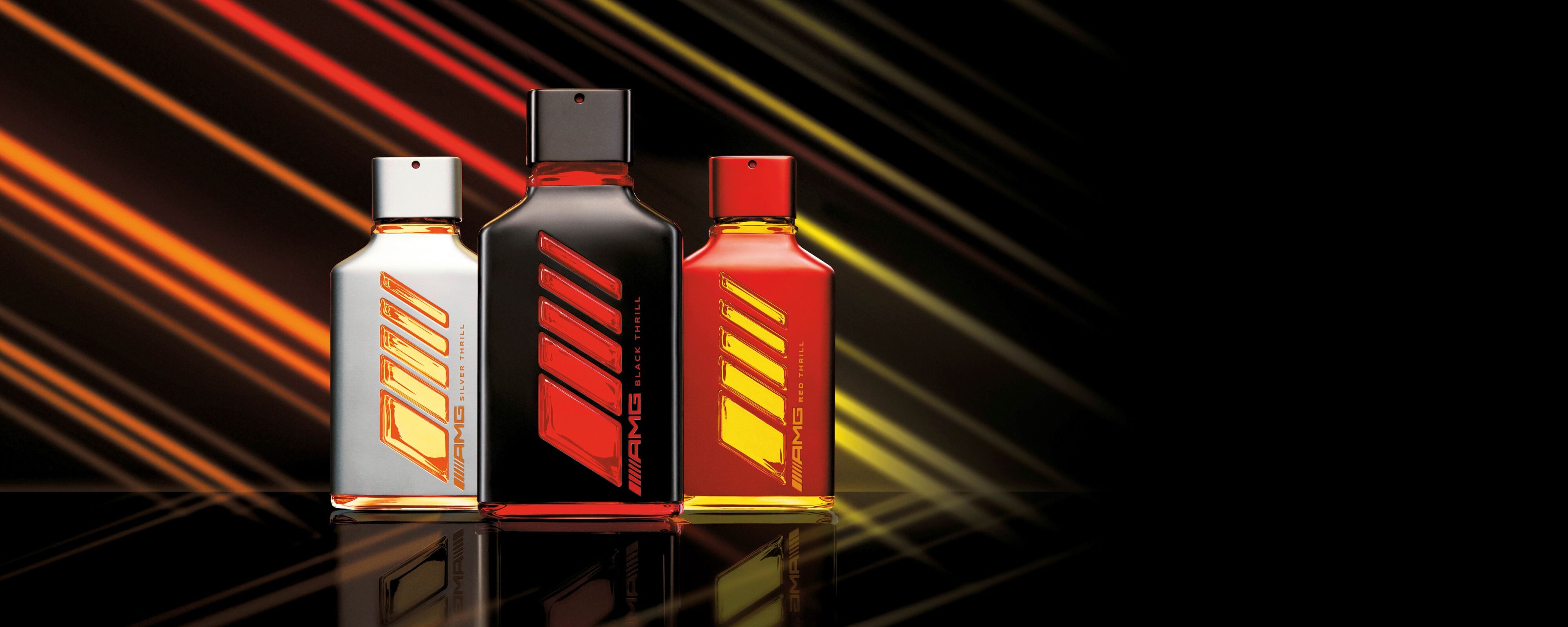 Promotional photo of a trio of Mercedes-AMG fragrances.