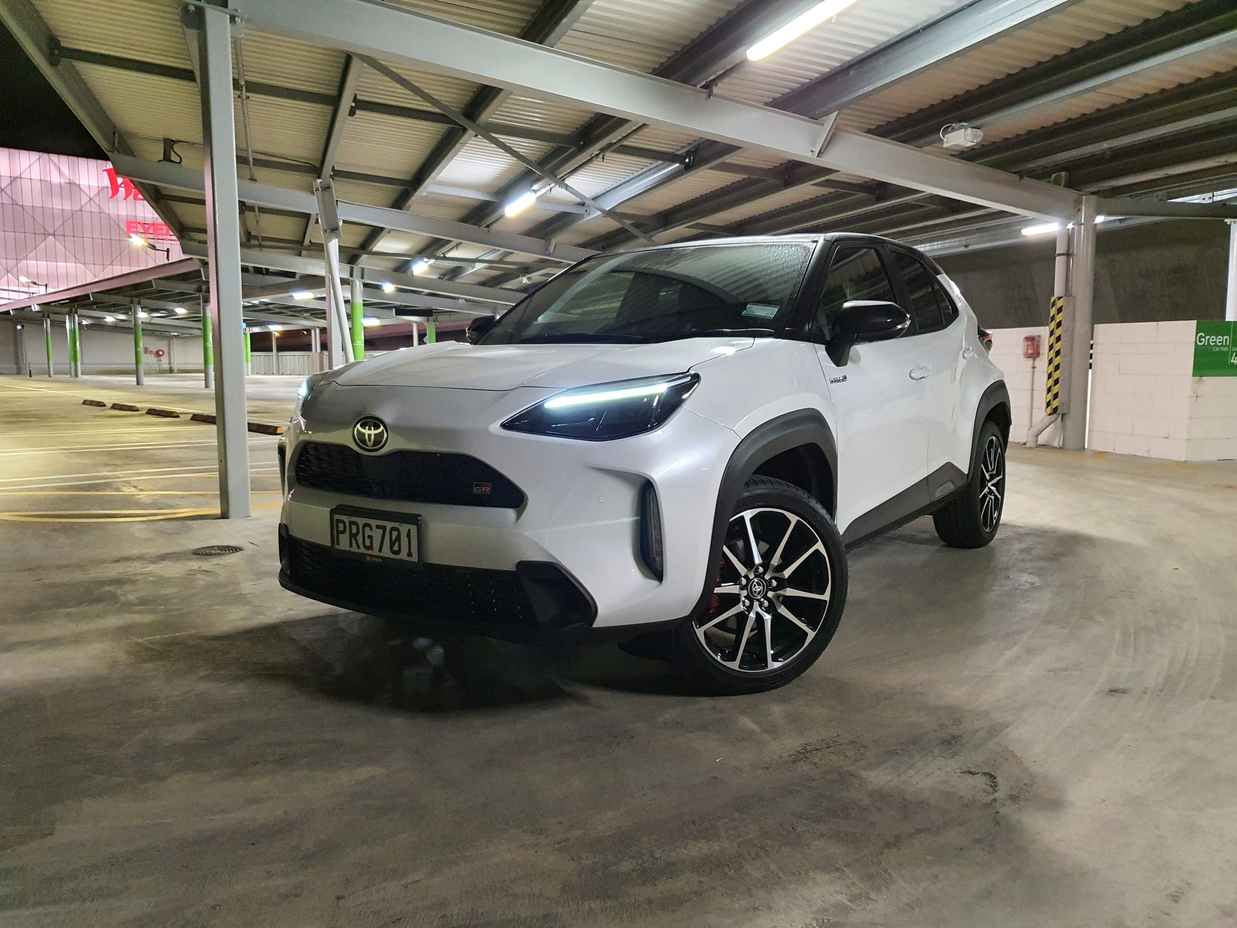 Front three quarters view of a 2023 Toyota Yaris Cross GR Sport in white and black.