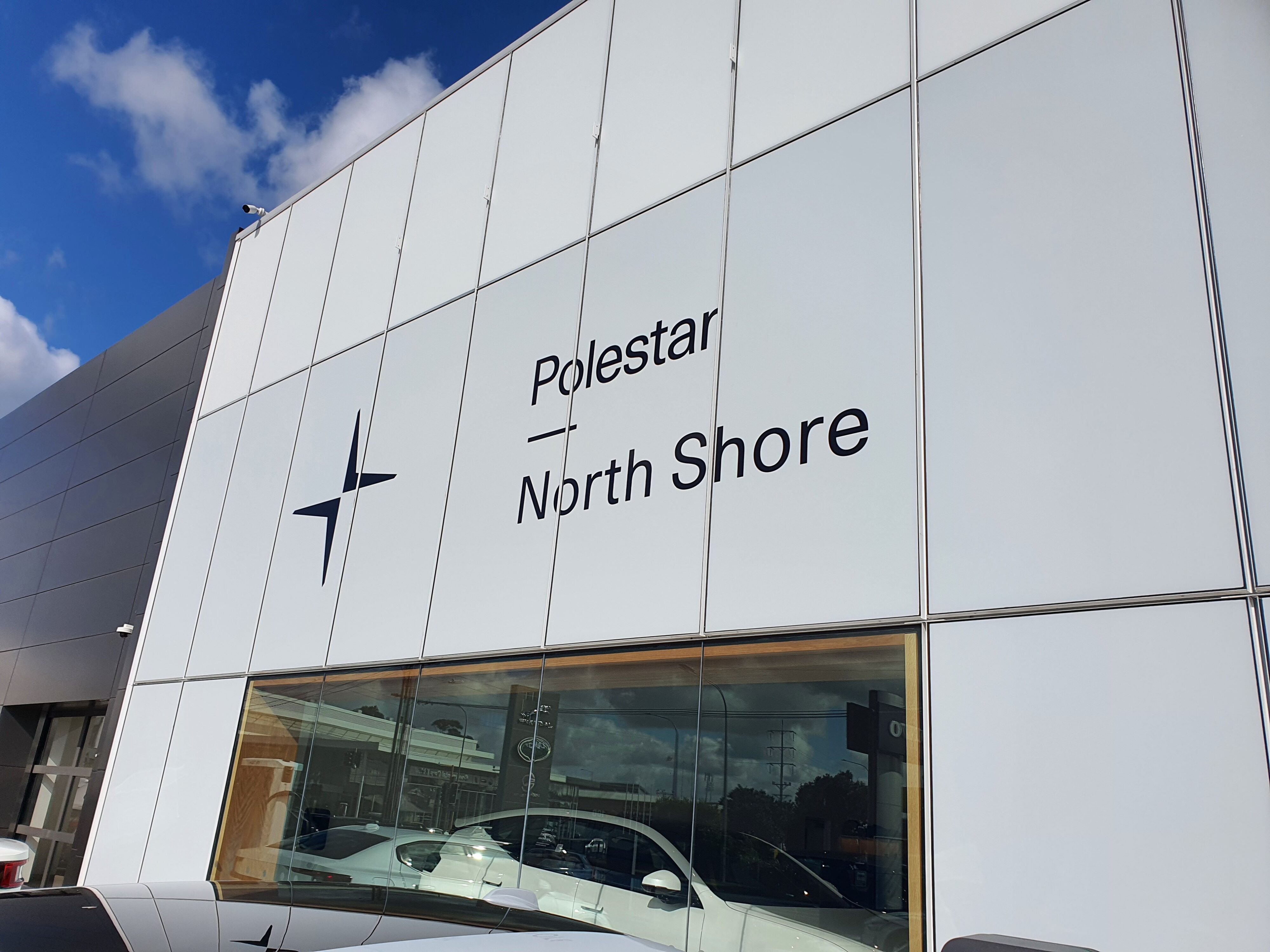 A photo of the exterior of the Polestar North Shore dealership in Auckland.