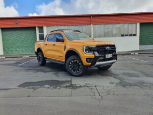 Front three quarters view of a 2023 Ford Ranger Wildtrak X in Cyber Orange.
