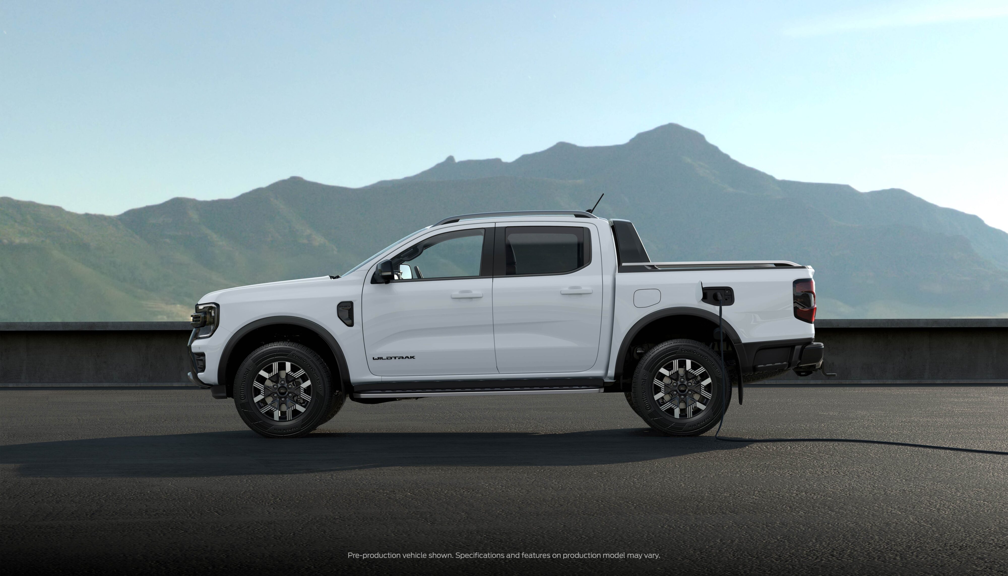 Side on view of a 2023 Ford Ranger PHEV in White.