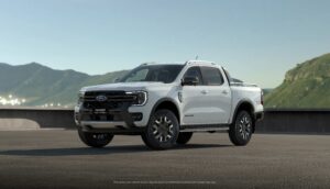 Front three quarters view of a 2023 Ford Ranger PHEV in White.