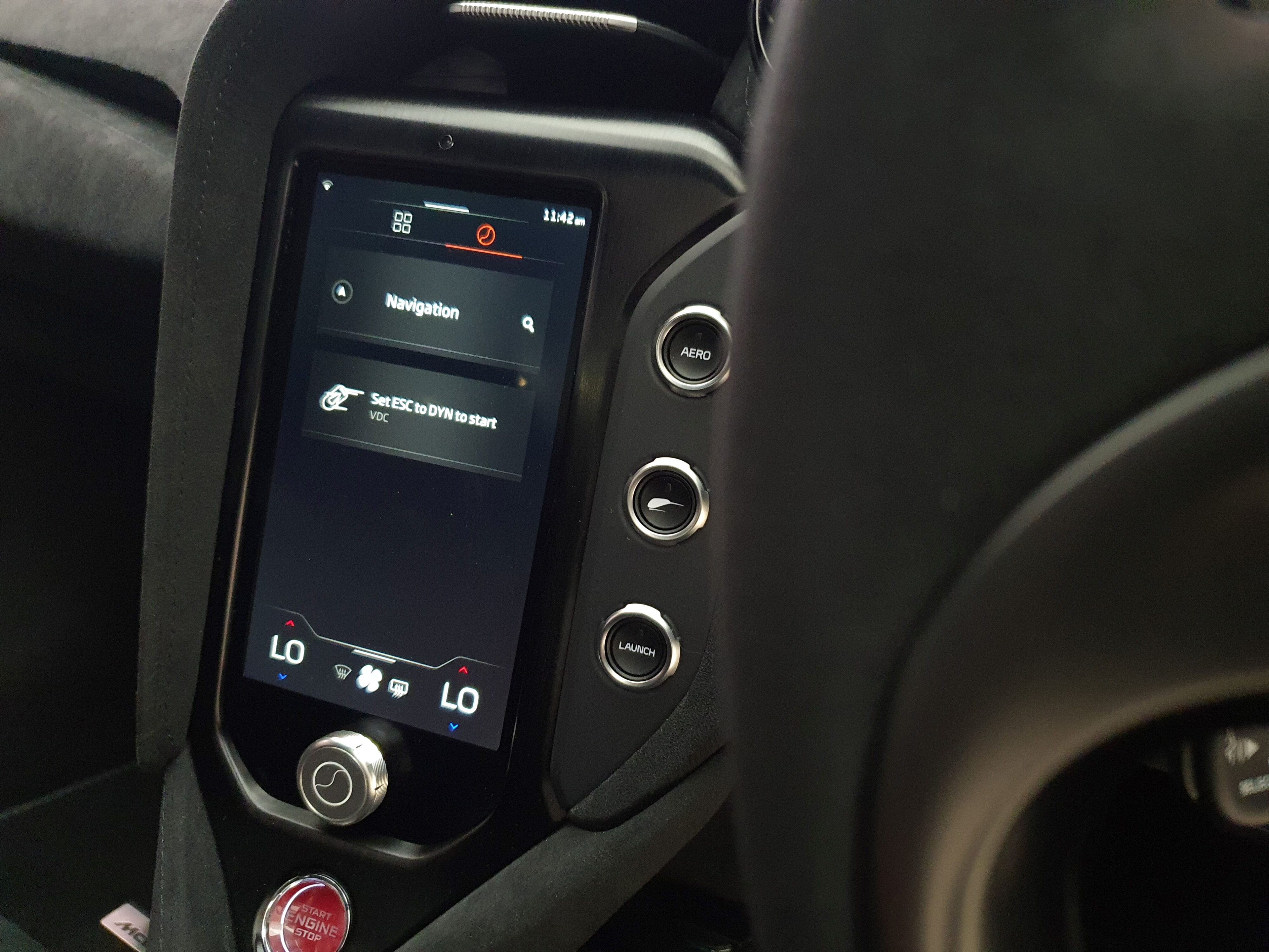 A photo of the interior of the new McLaren 750S depicting the centre console and the 'Flying Kiwi' button.