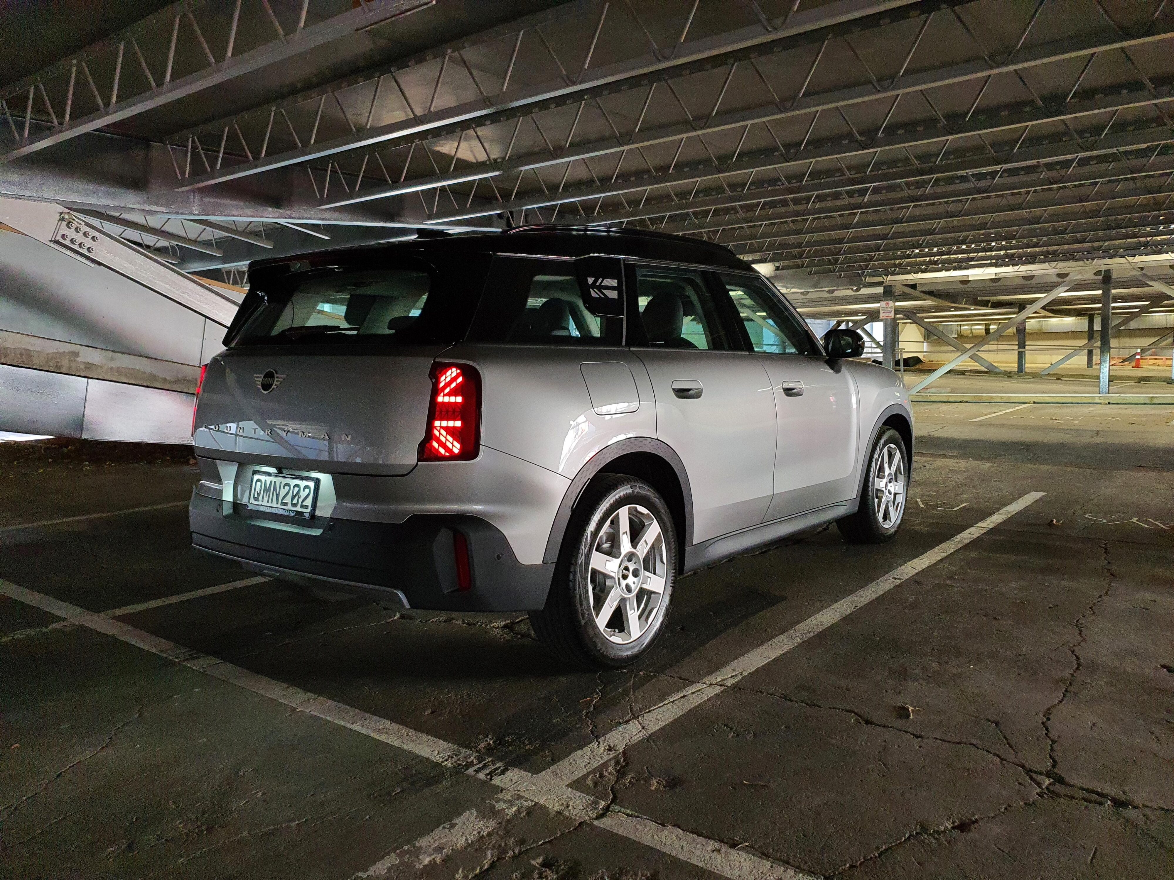 Rear three quarter view of a 2024 Mini Countryman C Classic in Silver in an underground carpark.