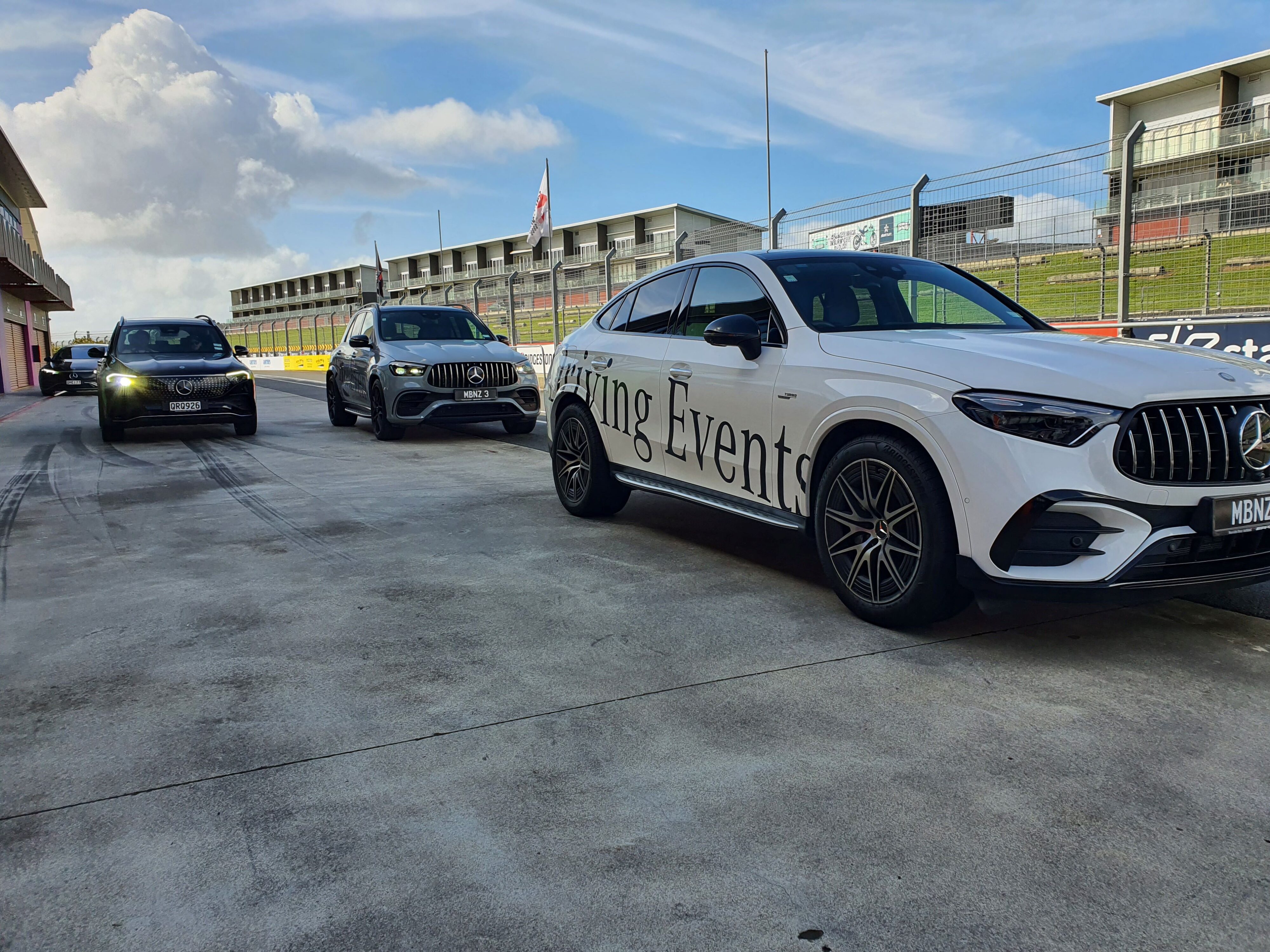 A trio of Mercedes-AMG cars including a GLC43 AMG Coupe, EQB 250+ and a GLE63 AMG S at the Mercedes Driving Event at Hampton Downs in August 2024.
