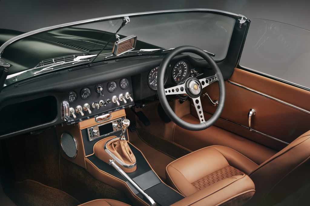 Tan leather interior of a 2024 Jaguar E-type drophead coupe. 