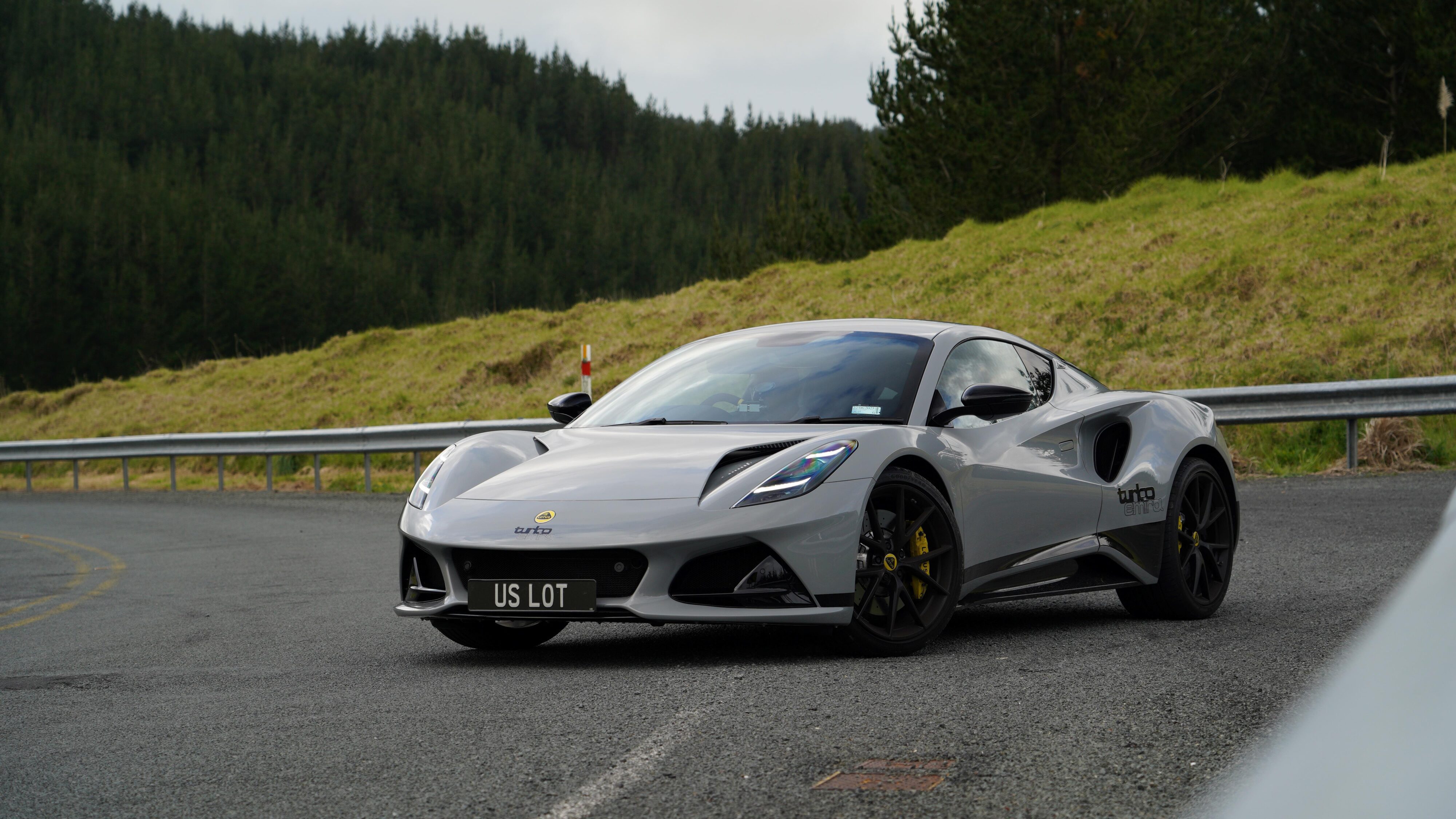 Front three quarters view of a 2024 Lotus Emira i4 Turbo in Nimbus Grey.