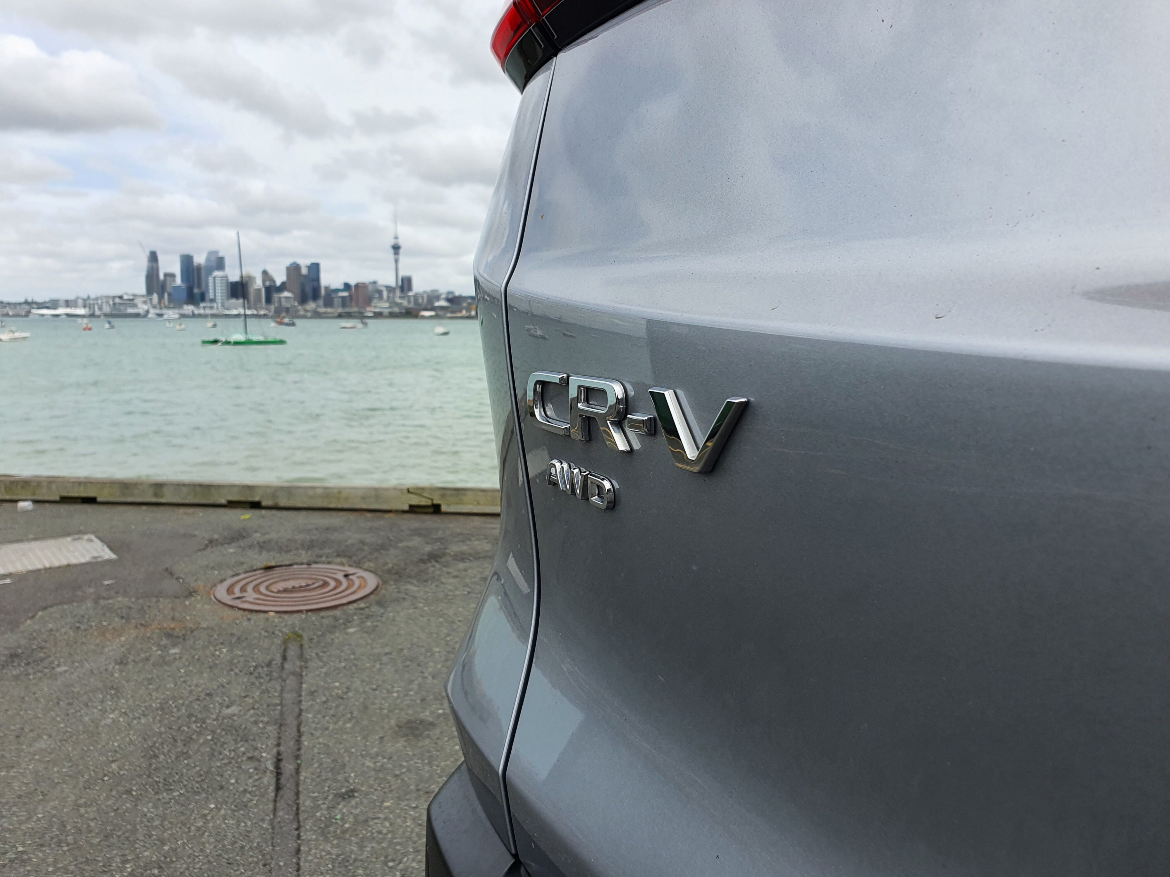 CR-V AWD badge on the rear of a 2024 Honda CR-V AWD in Silver.