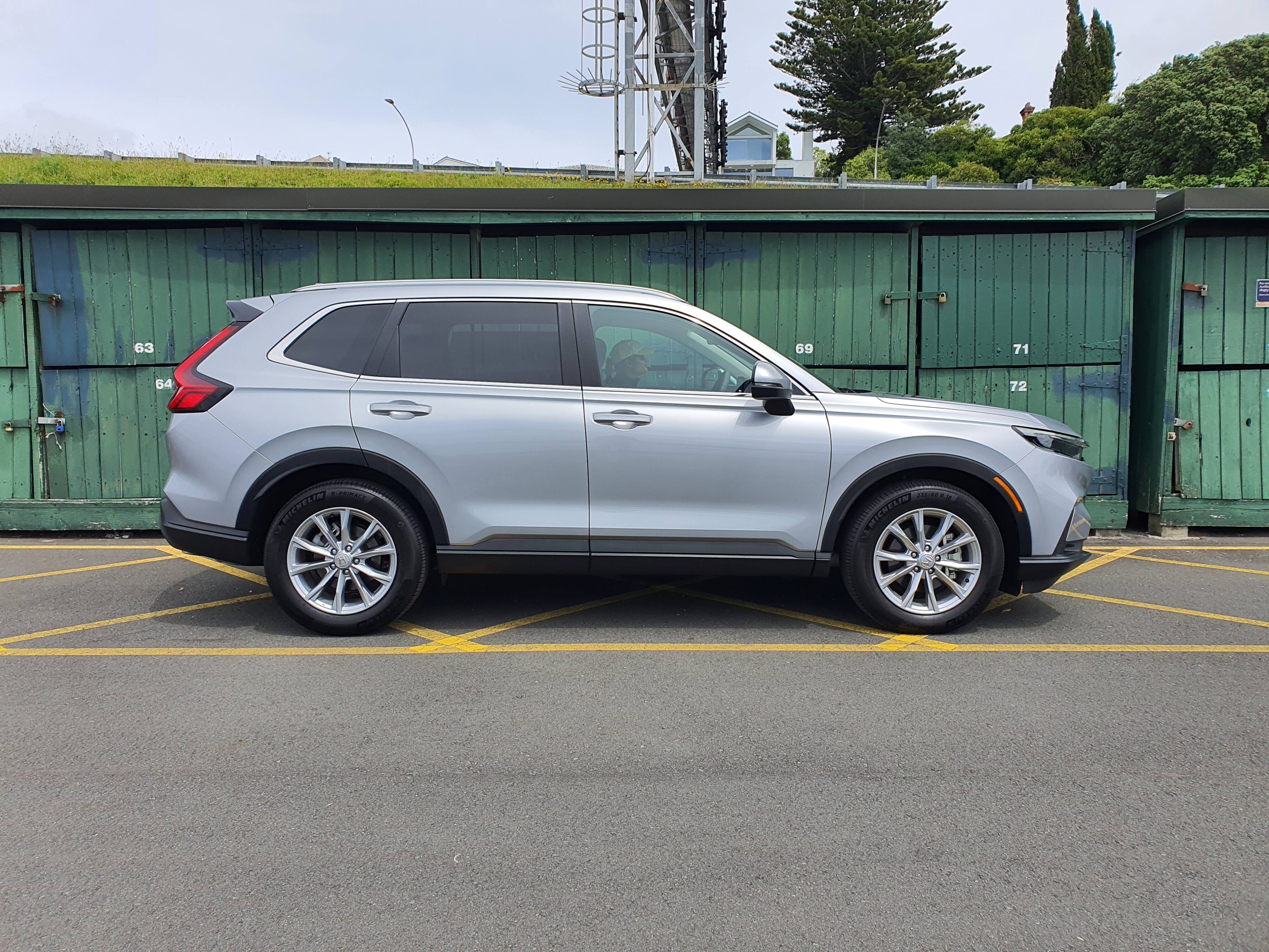Side view of a 2024 Honda CR-V AWD in Silver.