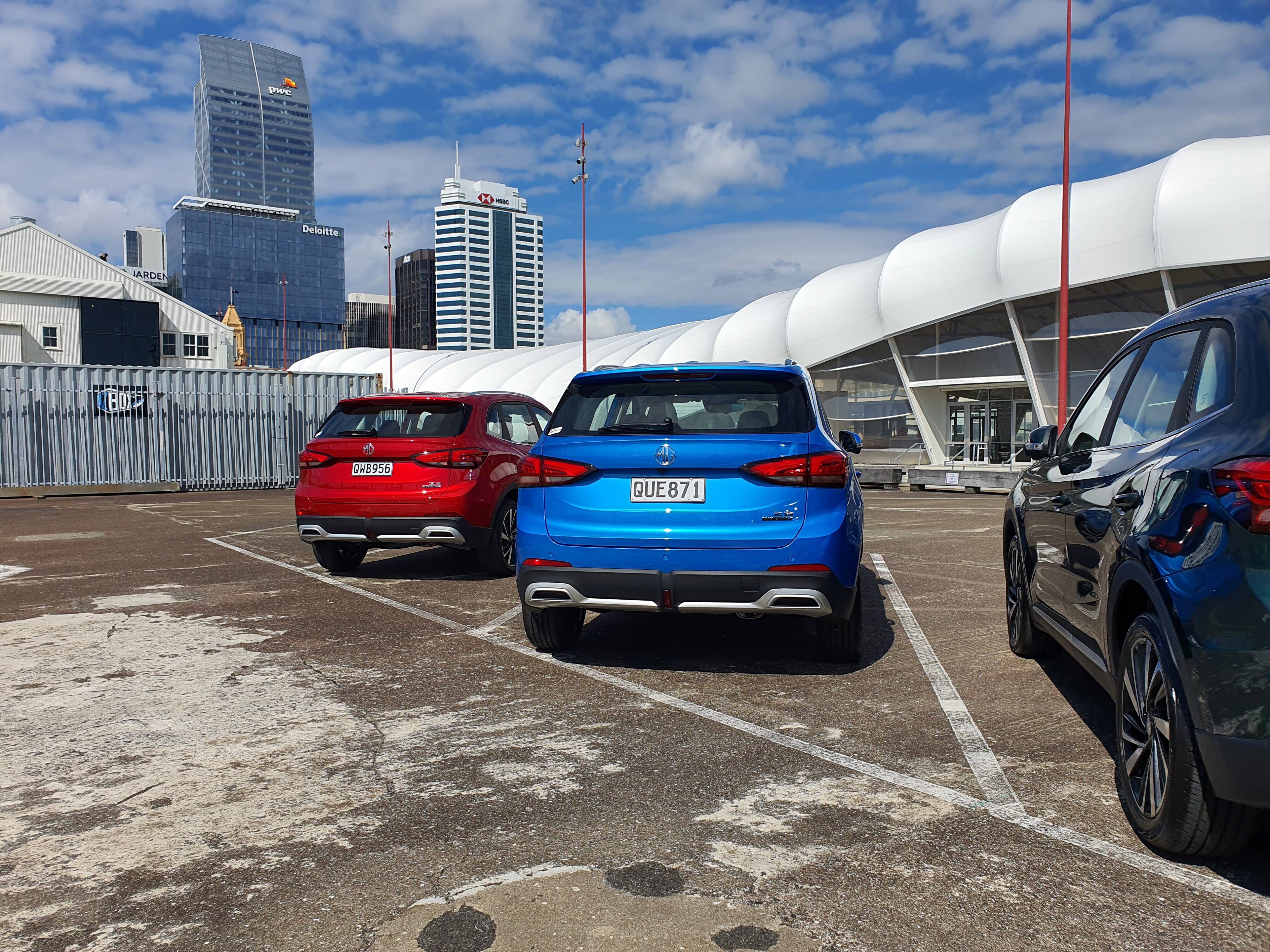 Two MG ZS Hybrid+ vehicles pictured on the Auckland waterfront at the car's New Zealand launch.