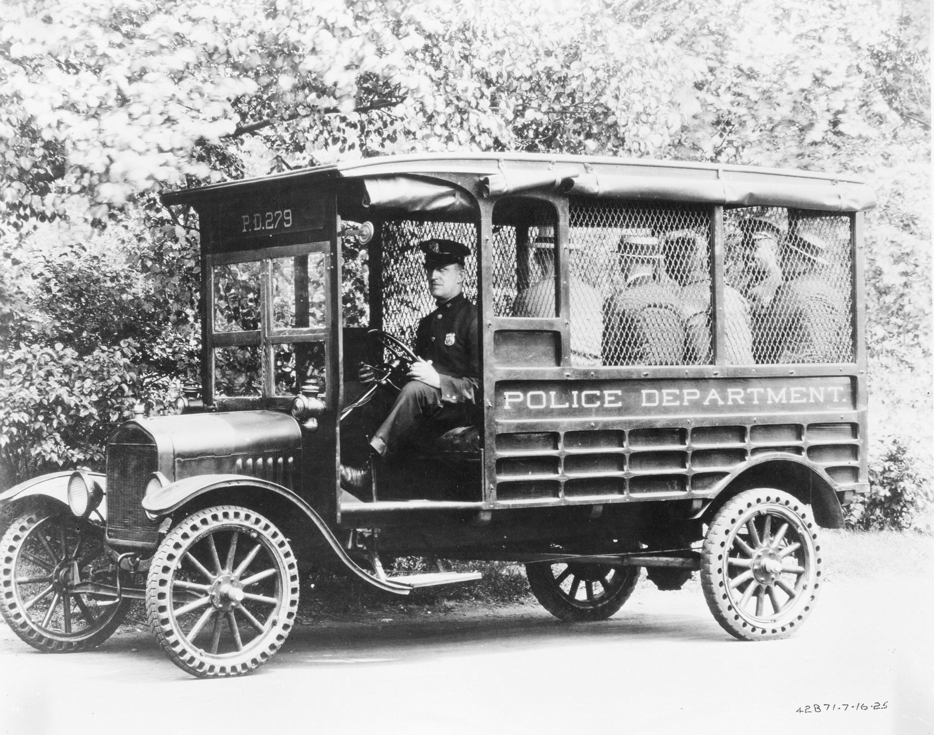 A 1918 Ford Model T police wagon pictured in black and white.