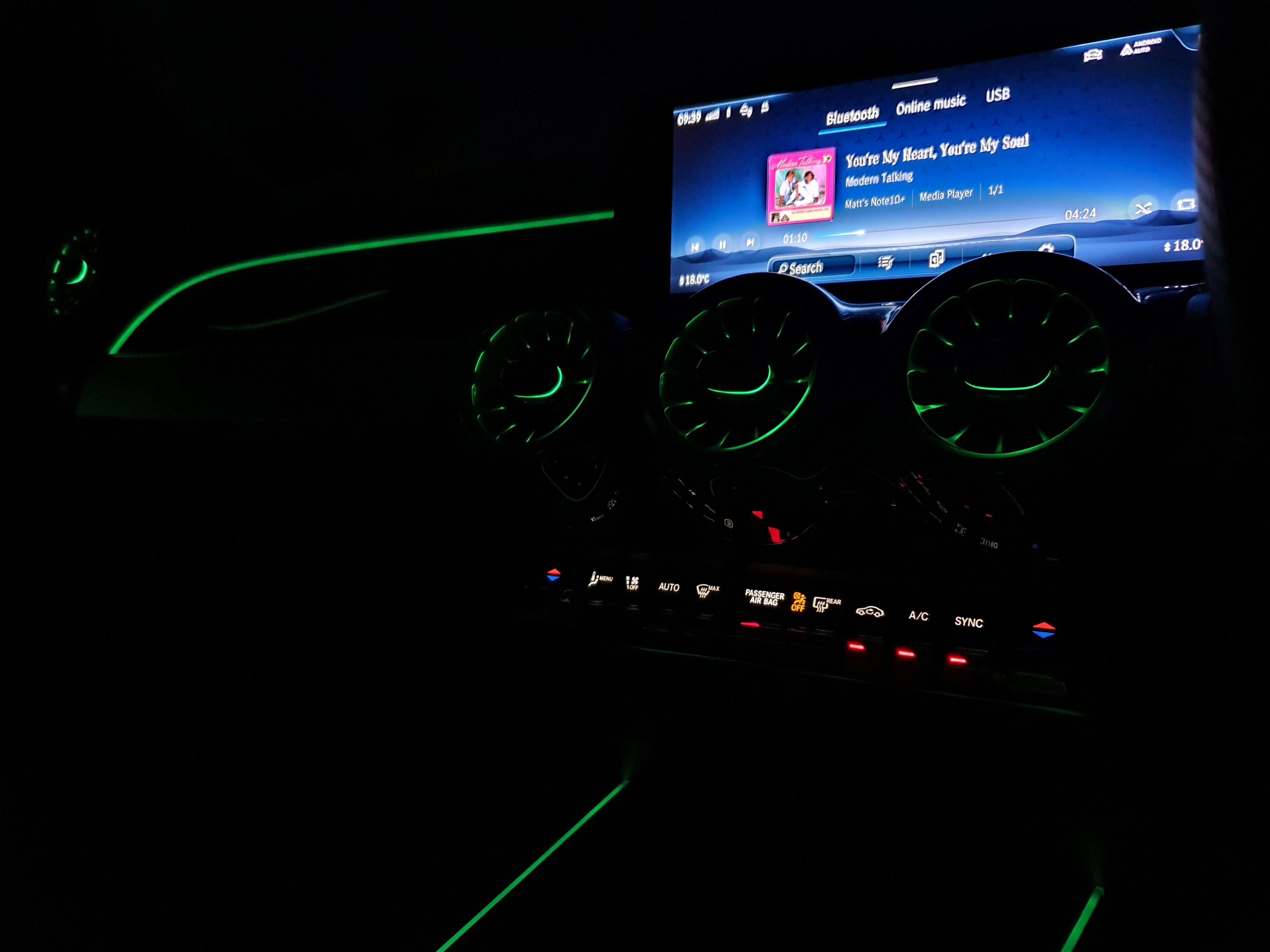 Ambient interior lighting on the inside of a 2024 Mercedes-AMG GLB 35 4MATIC in Black.