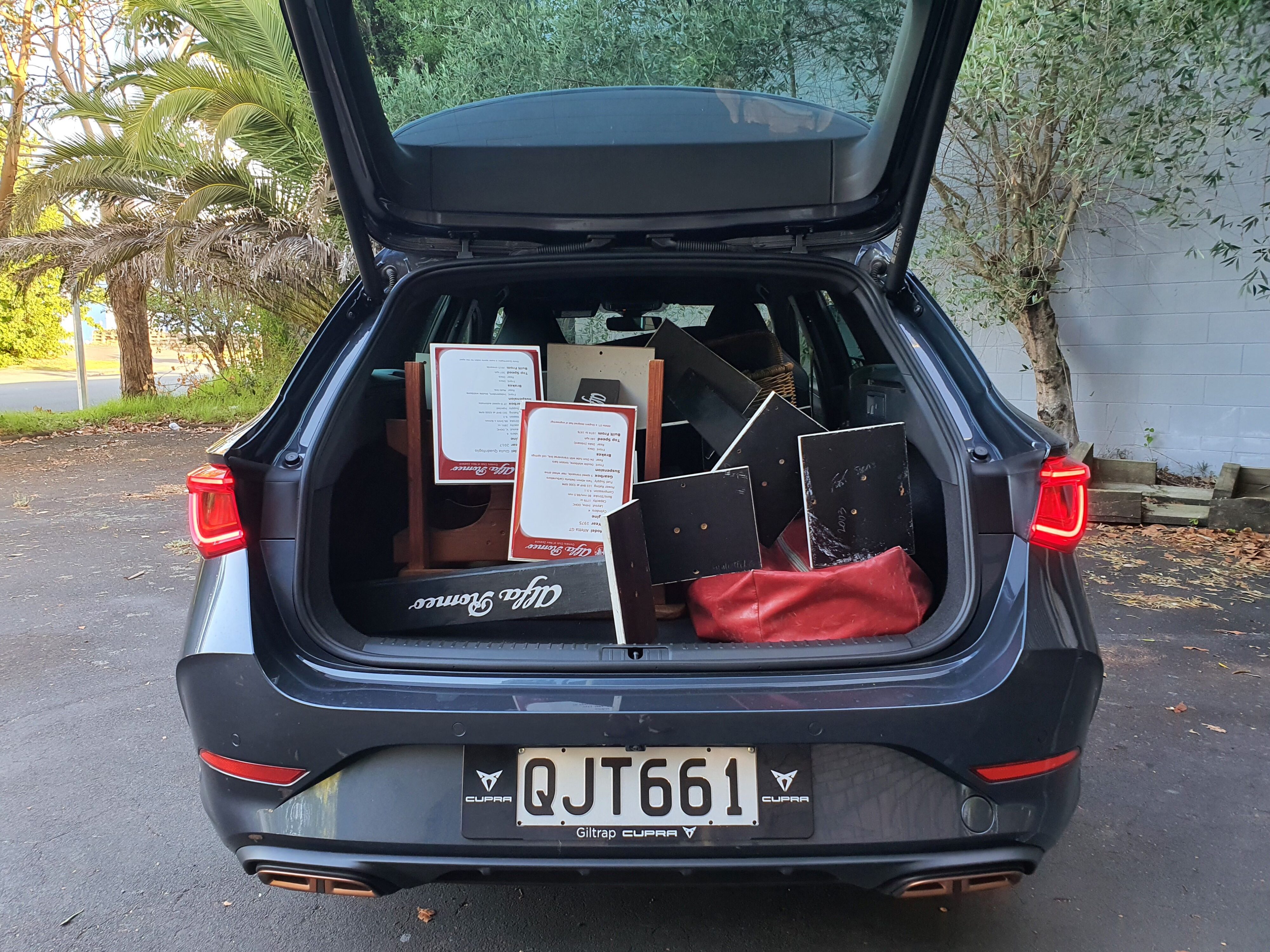 A 2024 Cupra Leon V Sportstourer in Magnetic Tech with its boot full.