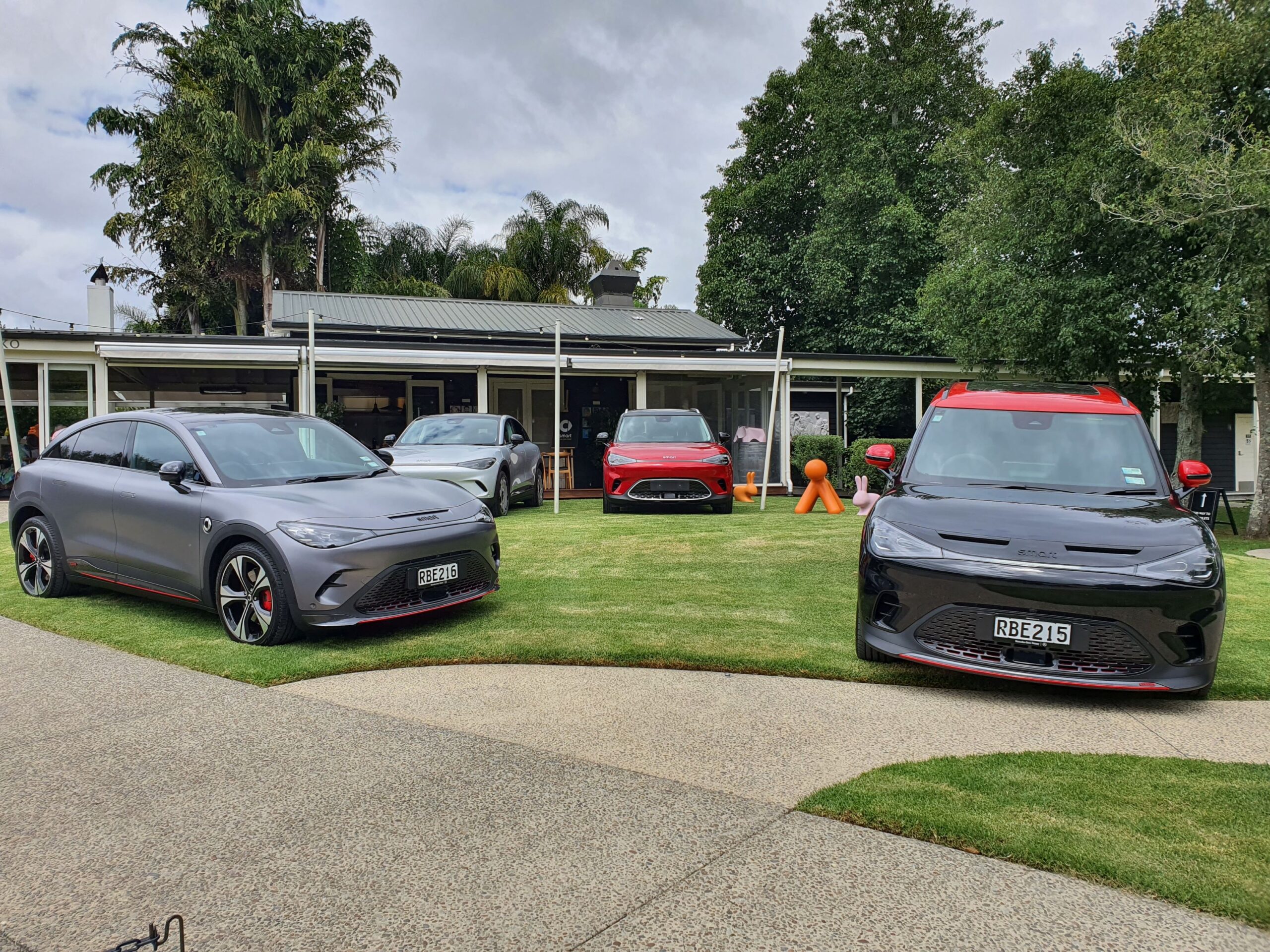 A range of smart #1 and #3 cars on the lawn outside of Rothko Restaurant at Sculptureum.