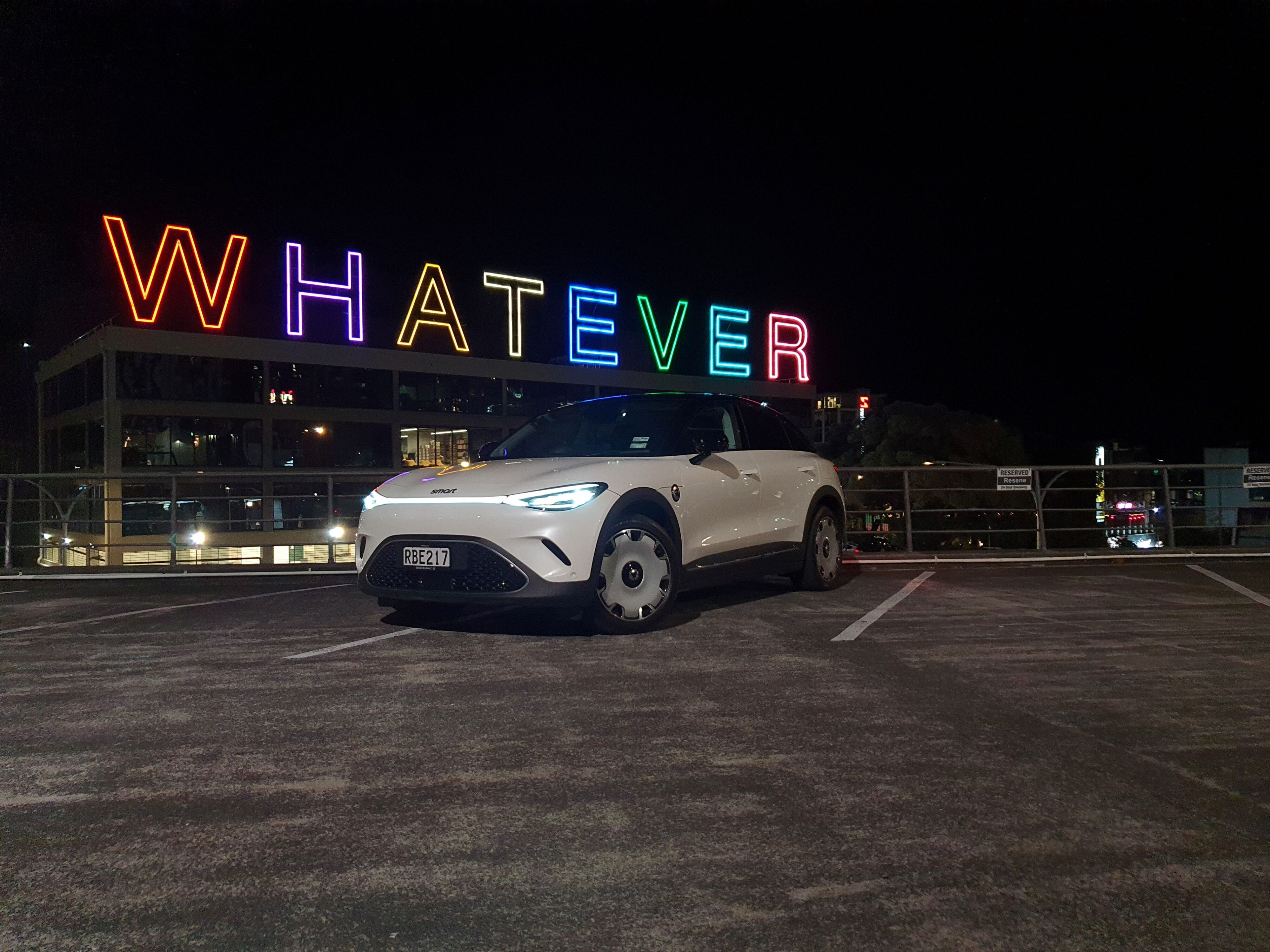 Front three quarters view of a white/black smart #3 Premium in Auckland.