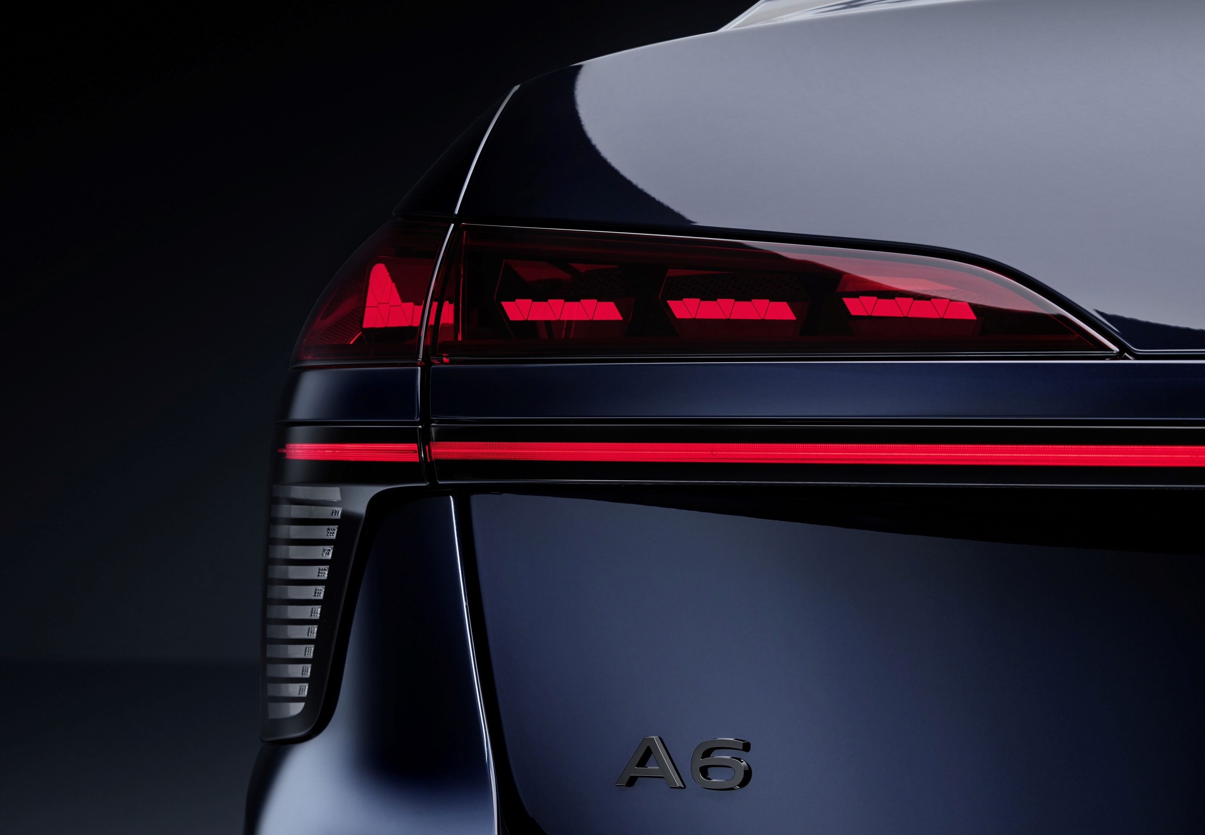 Teaser image of a taillight of the new Audi A6