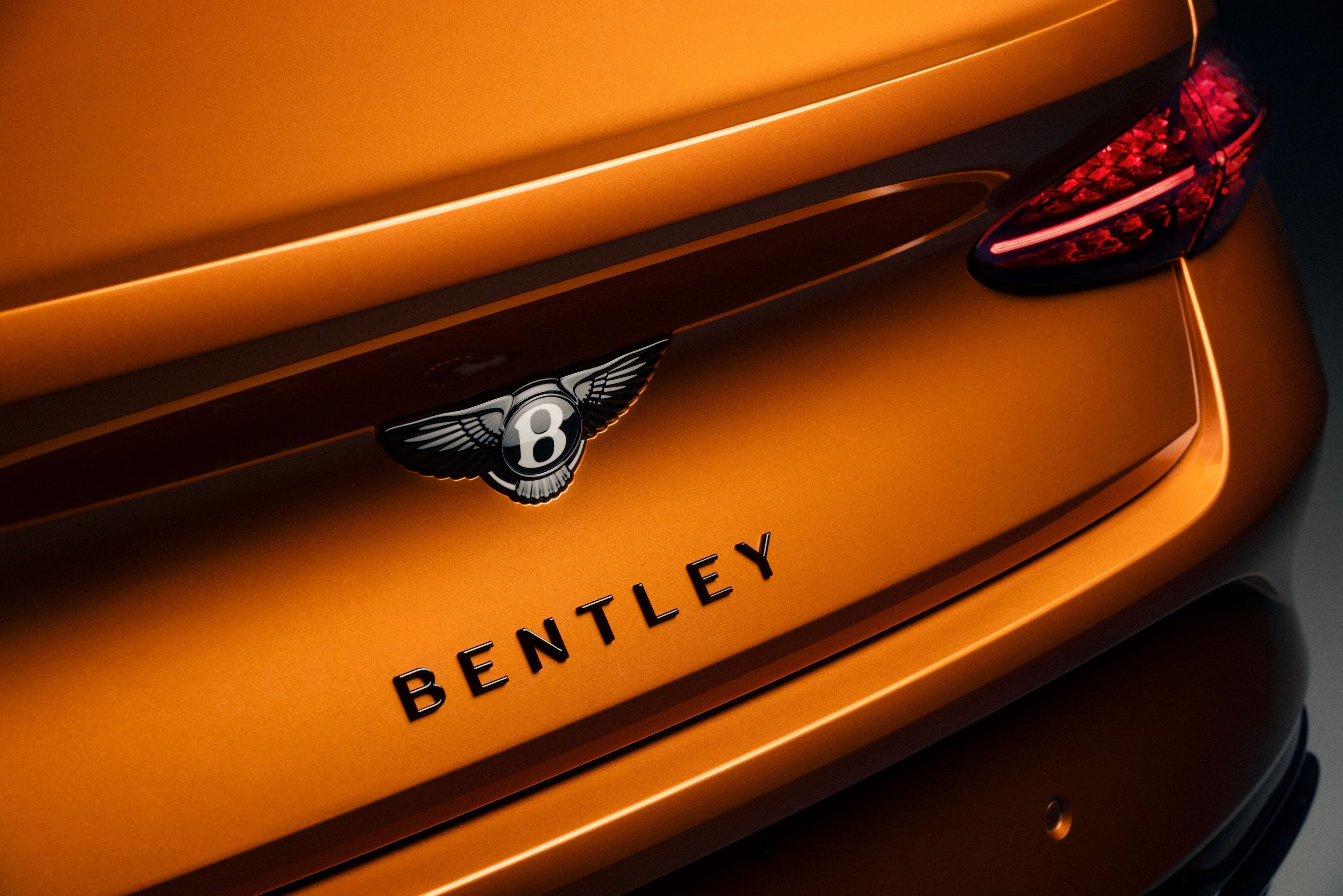 Rear view of a Bentley Continental GT Black Edition with black Bentley Wings.