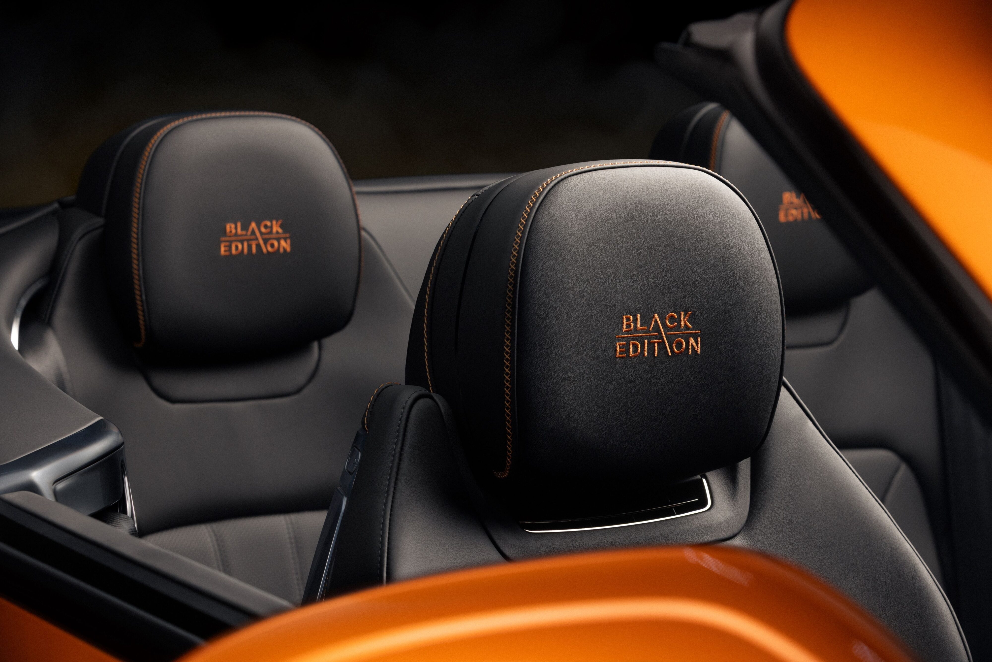 View of the 'Black Edition' embroidered headrests on the interior of a Bentley Continental GTC Black Edition.