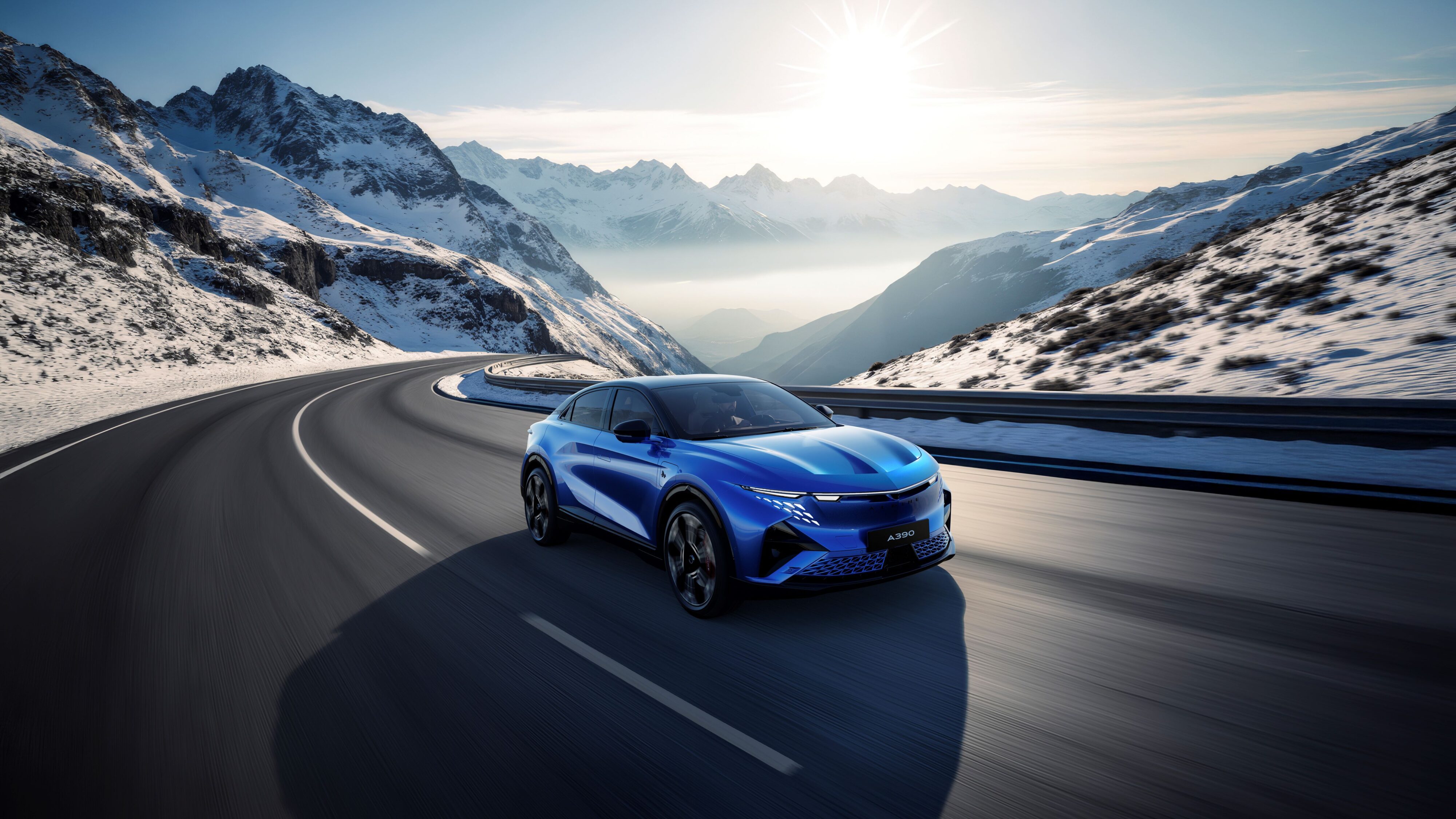 A photo of the new Alpine A390 in blue with snow capped mountains in the background.