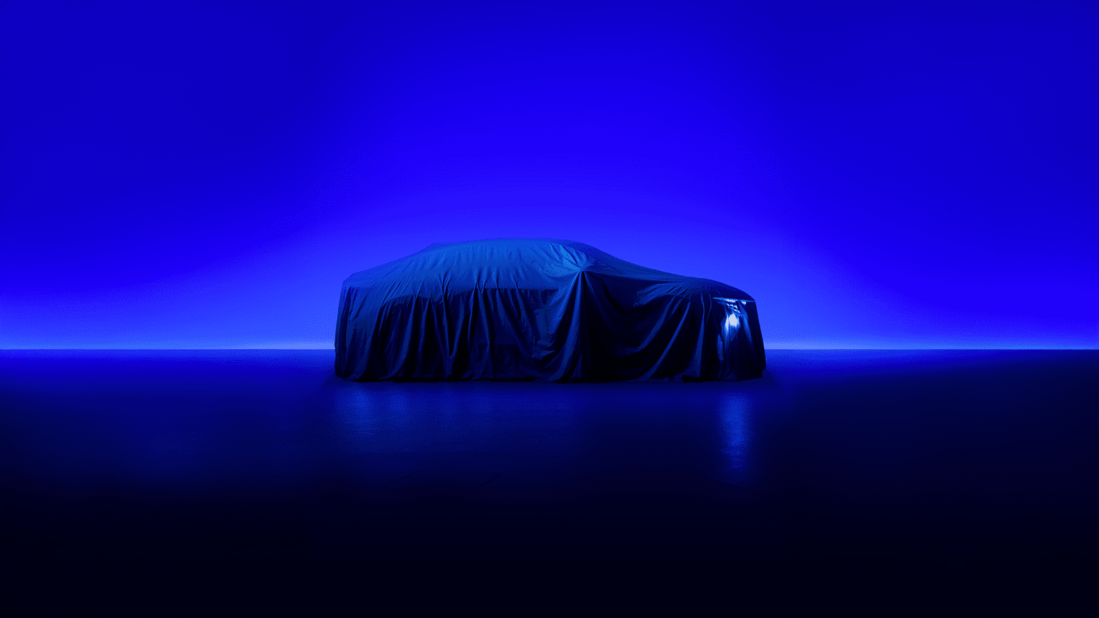A side on view of the Alpine A390 under cover head of its unveiling.