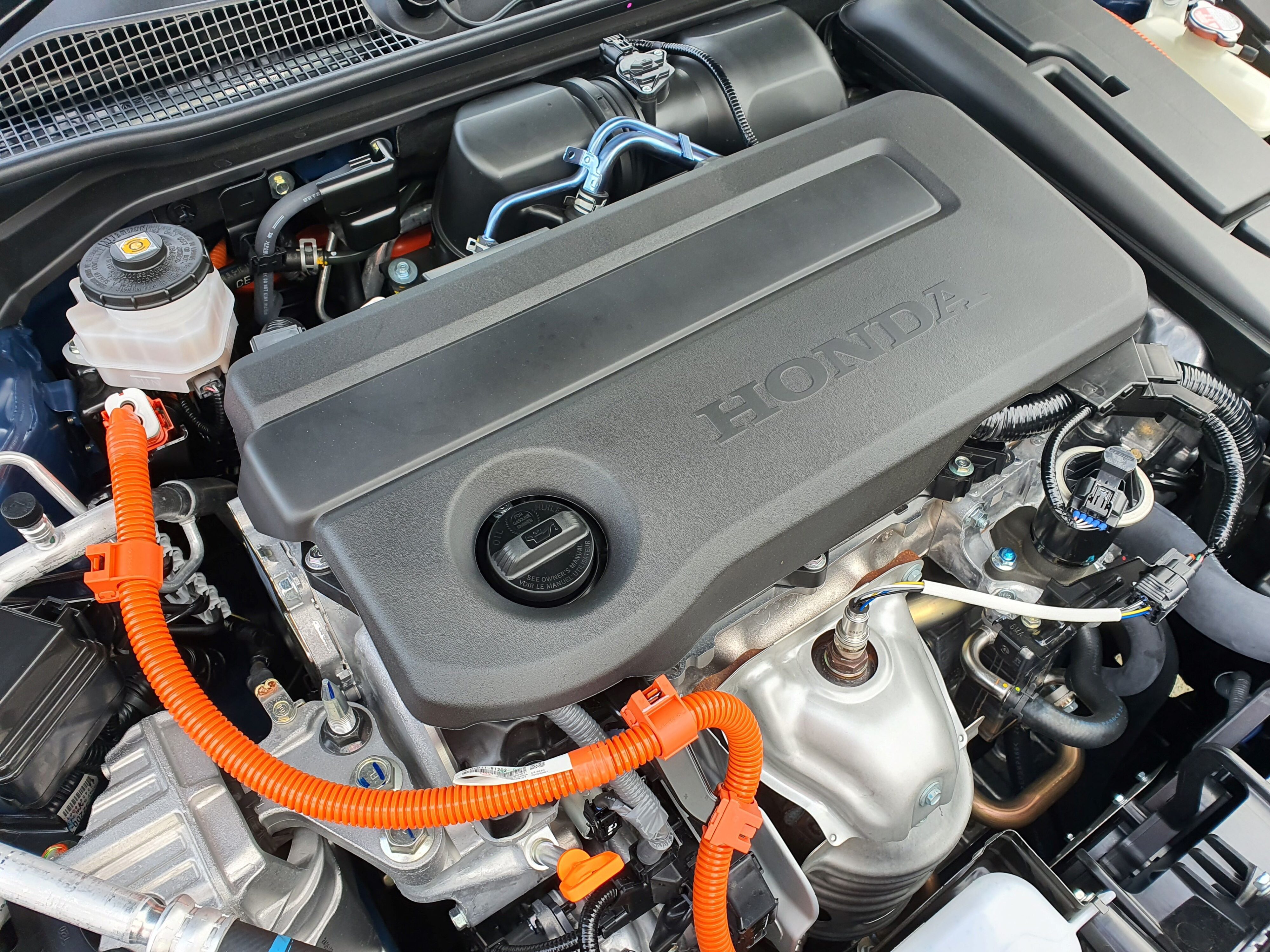 A photo of the engine bay of a 2025 Honda Civic SR e:HEV.