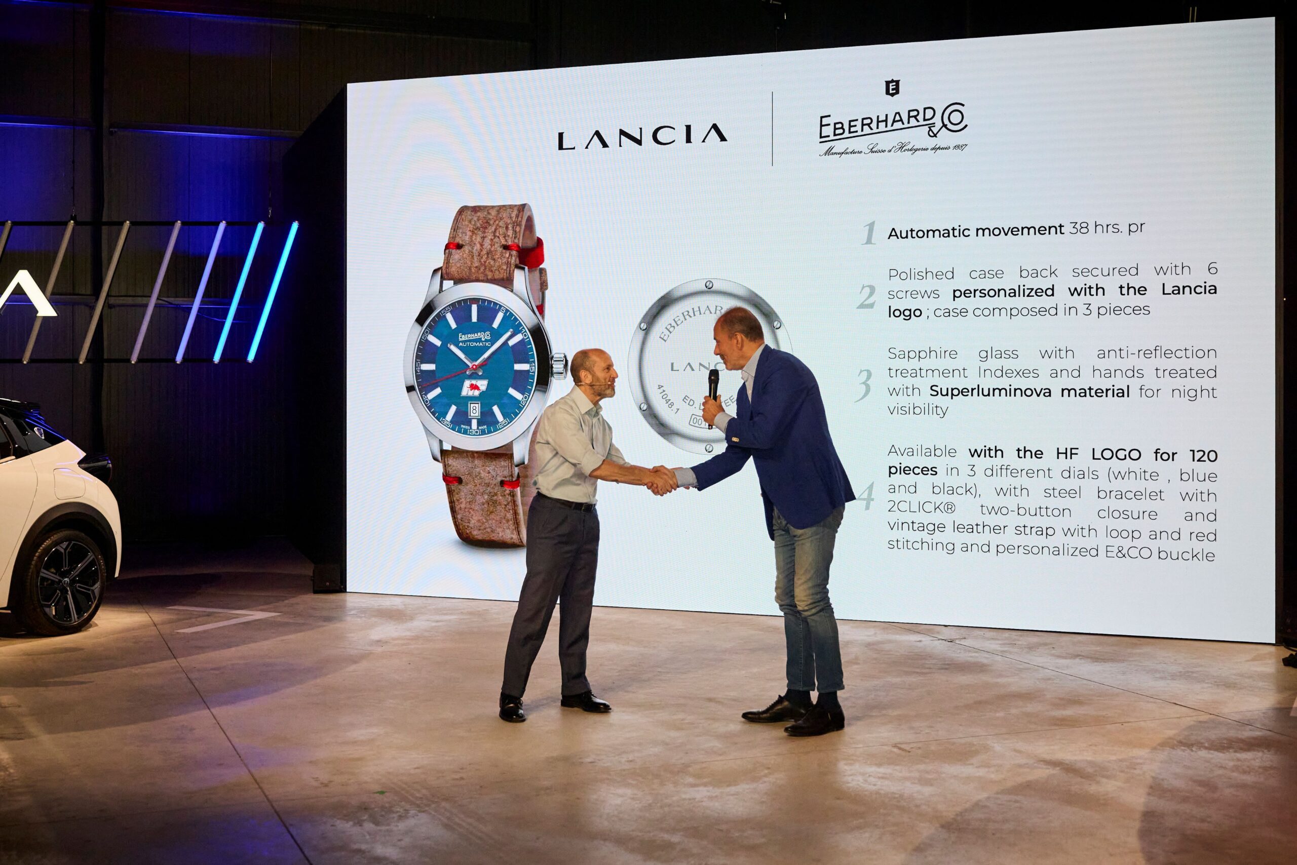 Luca Napolitano accepts an Eberhard & Co Lancia HF watch from Mario Peserico, MD of the brand.