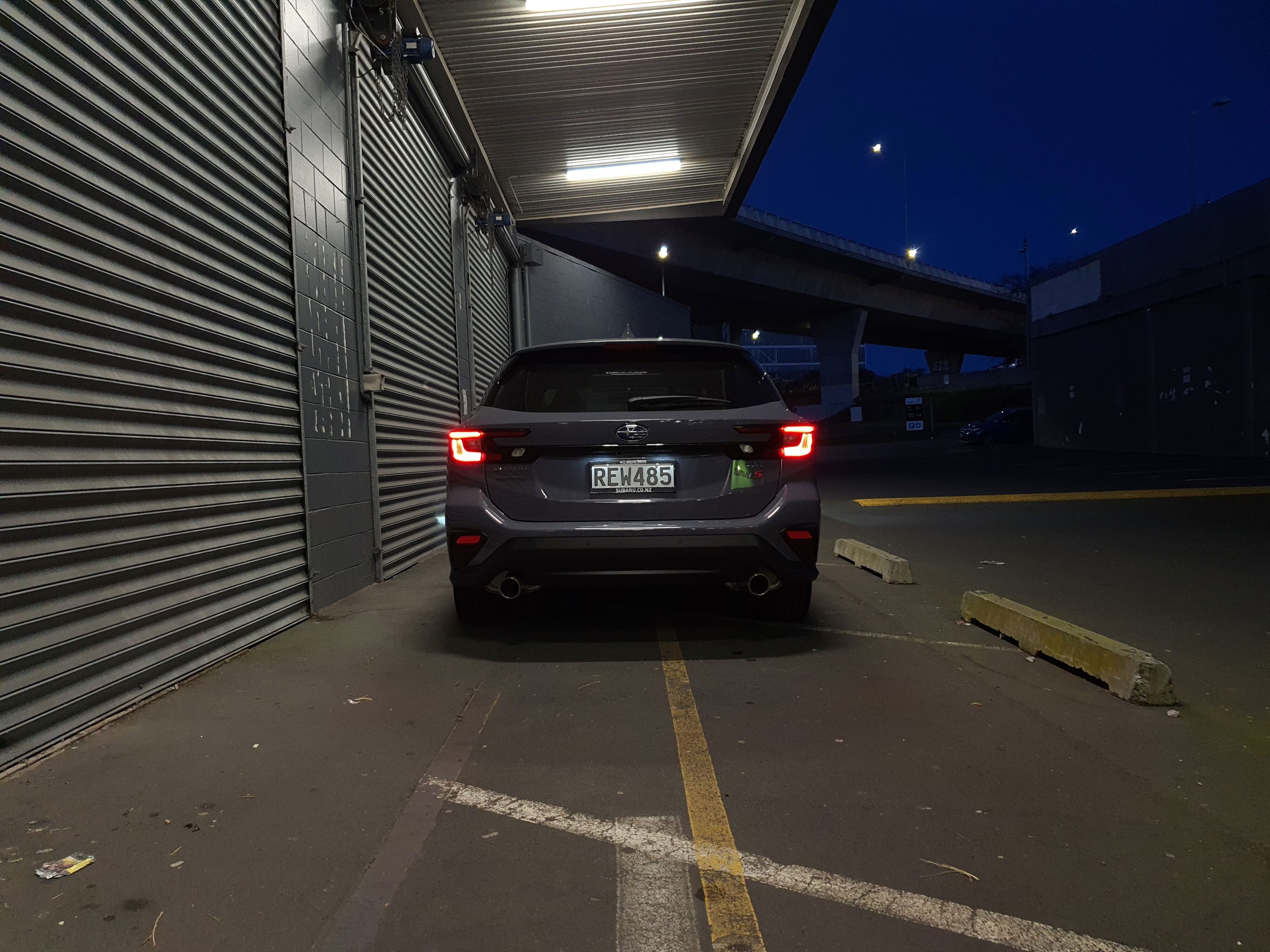 Straight on rear view of a 2025 Subaru WRX GT tS Wagon in Asteroid Grey Pearl.