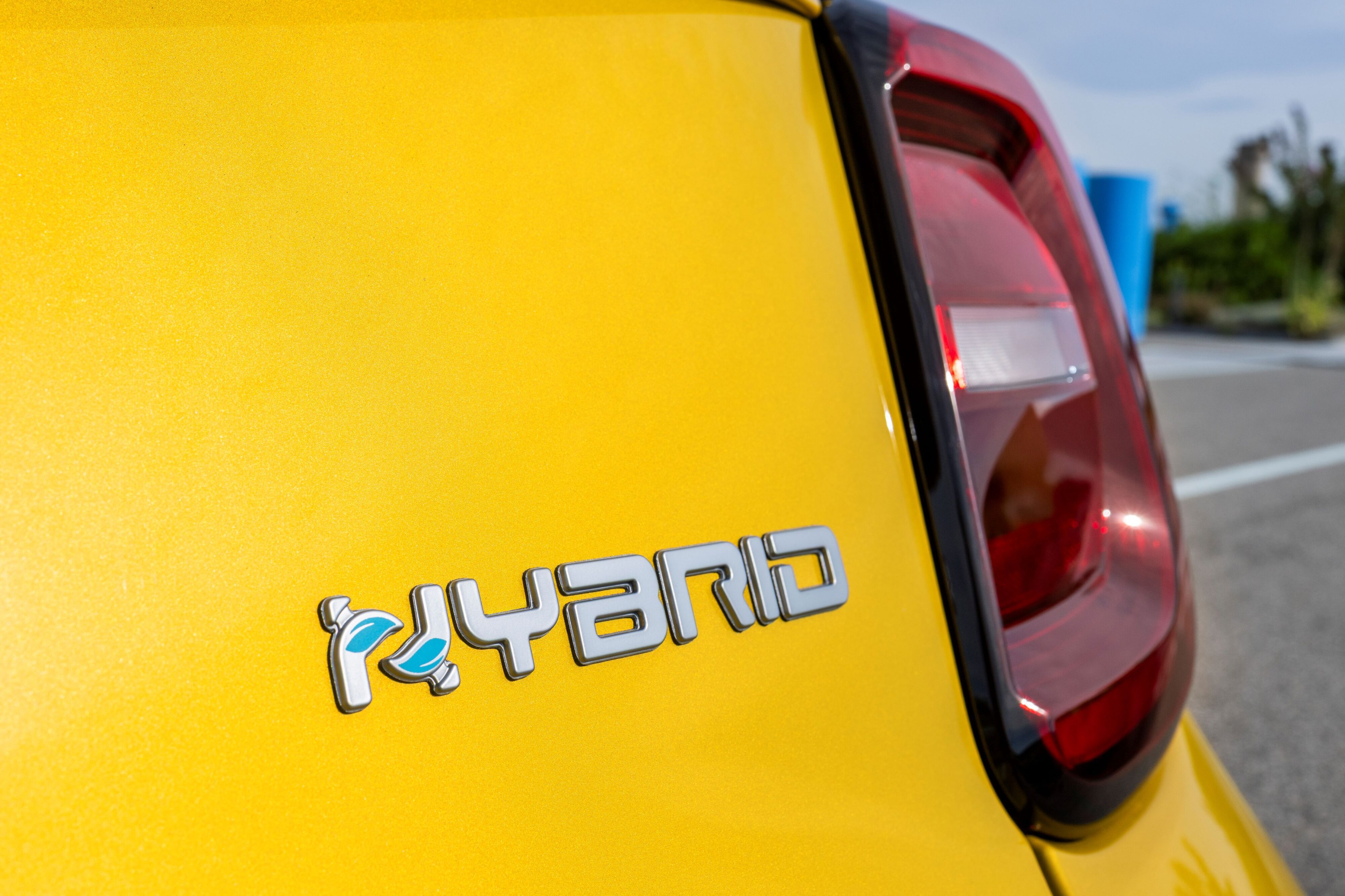 A photo of a hybrid badge on the rear of the new Fiat 500 hybrid.